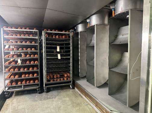 A large metal rack with wheels and shelves AI-generated content may be incorrect.